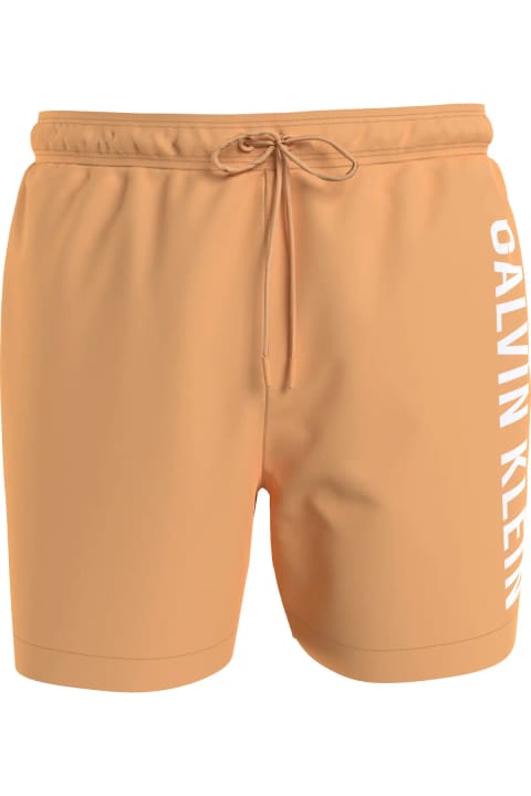 شورت ساحلی مردانه Calvin Klein با لوگو، پلیاستر سریعخشک — Turuncu Deni